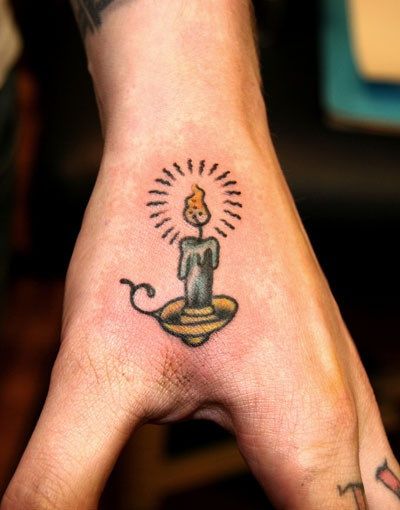 Micro candle tattoo by Sarah Carter
