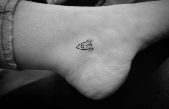Micro rocket tattoo on the ankle
