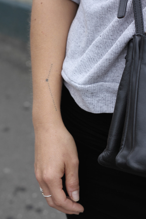 Minimal constellation tattoo on the forearm