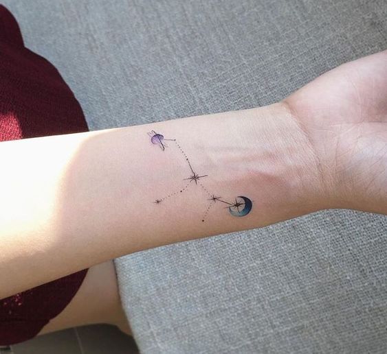 Moon and constellation tattoo on the wrist