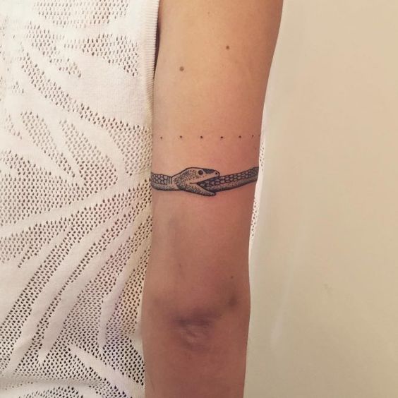 Ouroboros tattoo over the arm