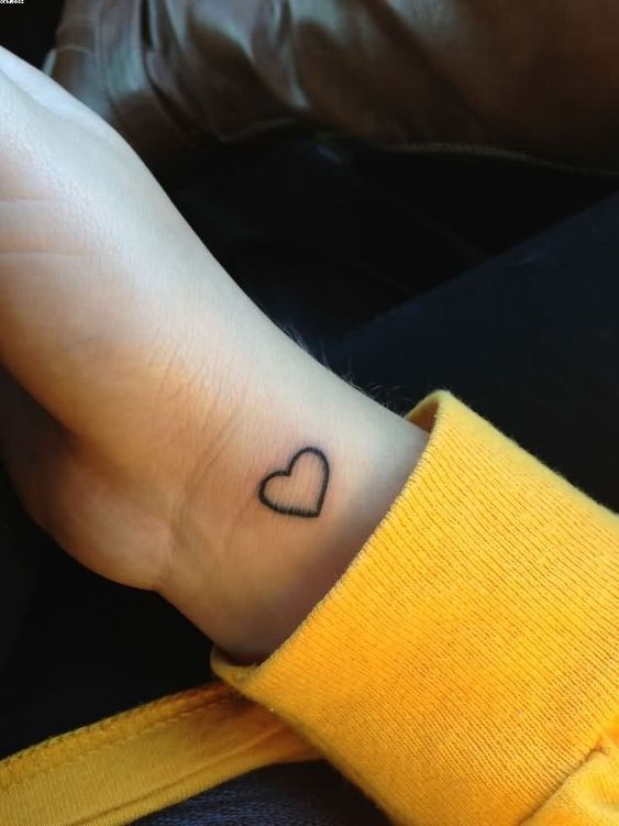 Outline heart tattoo on the wrist
