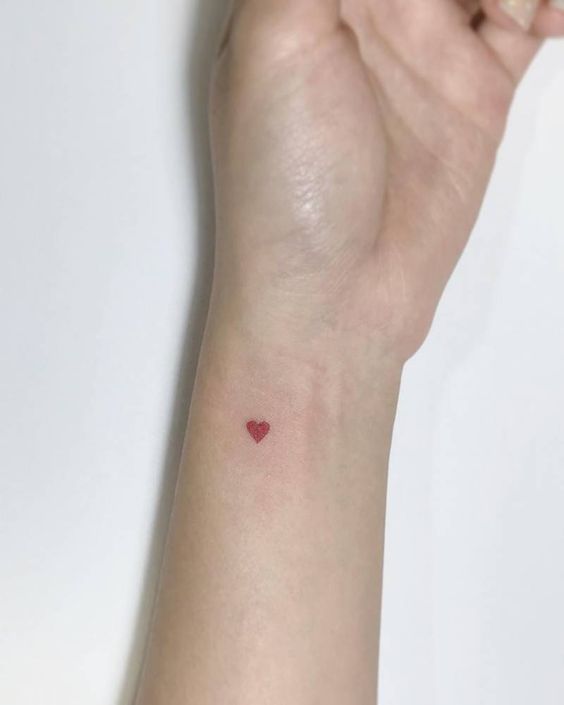 Red heart tattoo on the wrist