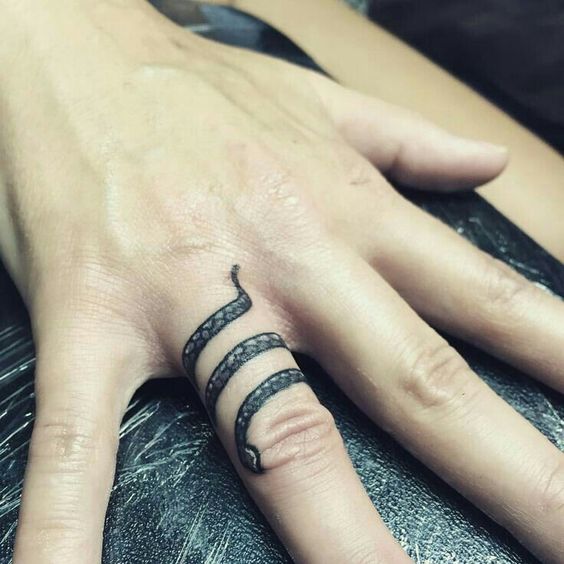 Ring snake finger tattoo