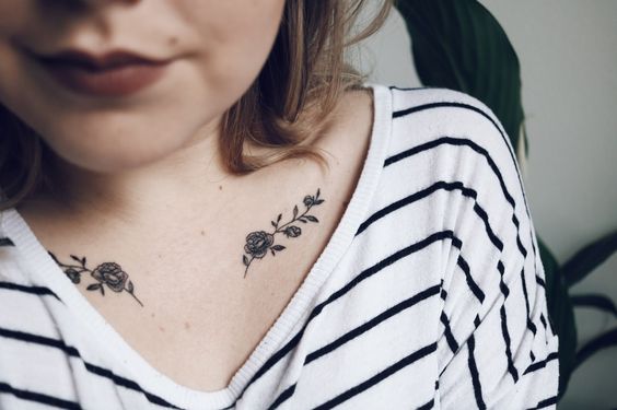 Rose tattoo on clavicle bone