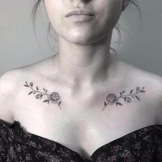Rose tattoos on both clavicle bones