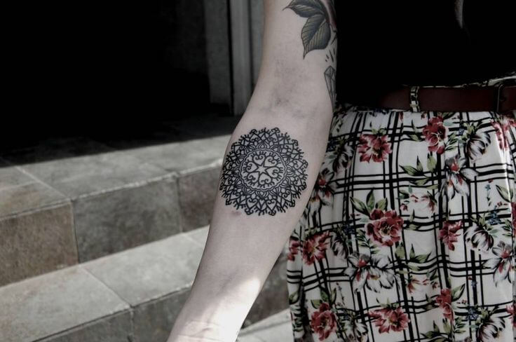 Sacred geometry black mandala tattoo with hearts inside