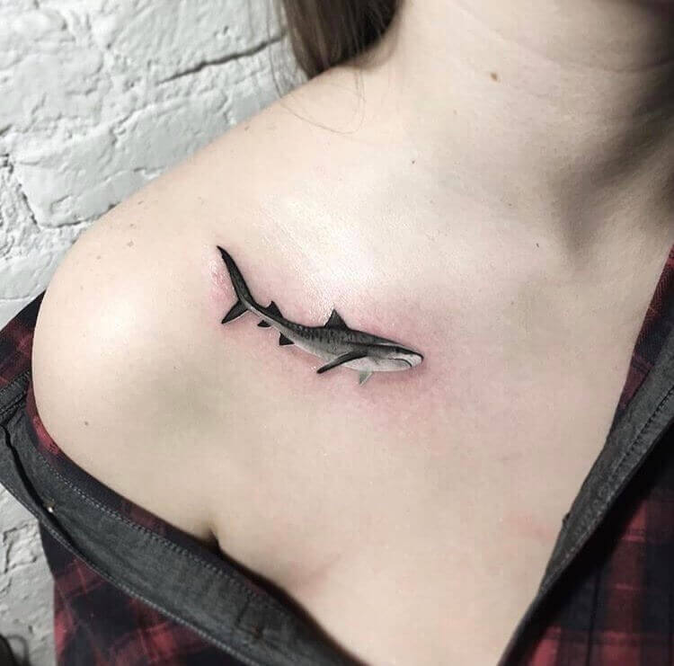 Shark tattoo on the clavicle bone