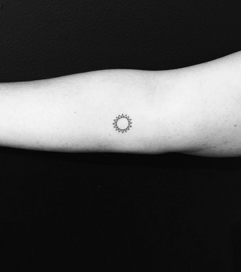 Simple small sun tattoo by Jon Boy