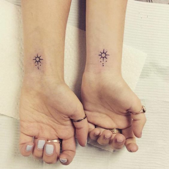 Sisters tattoo idea - matching suns on the wrists