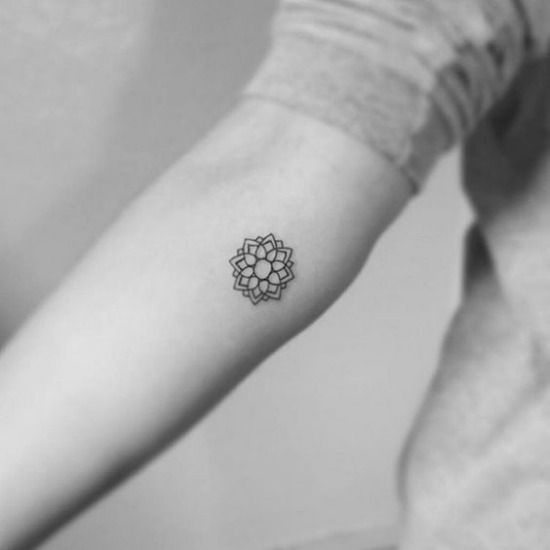 Small mandala tattoo on the inner arm