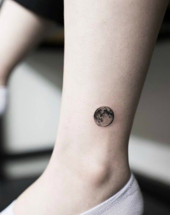Small moon tattoo on the ankle