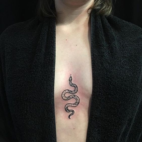 Small snake tattoo on the chest