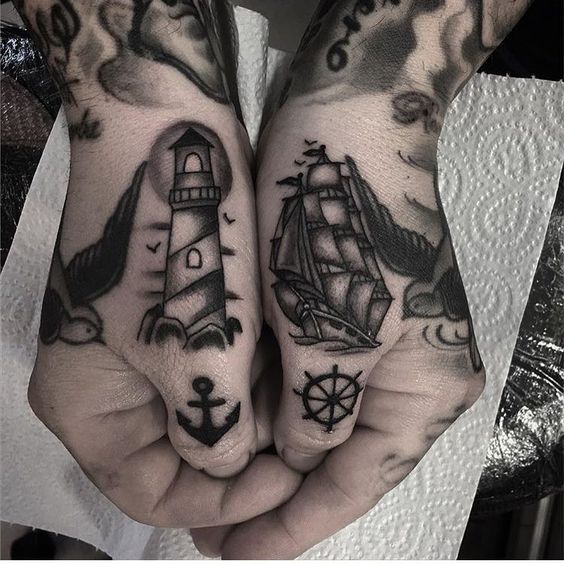 Small traditional sailor tattoos on hands