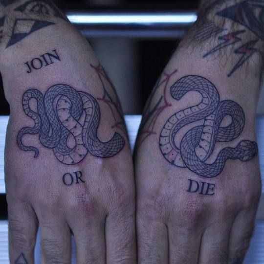 Snake tattoos on both hands