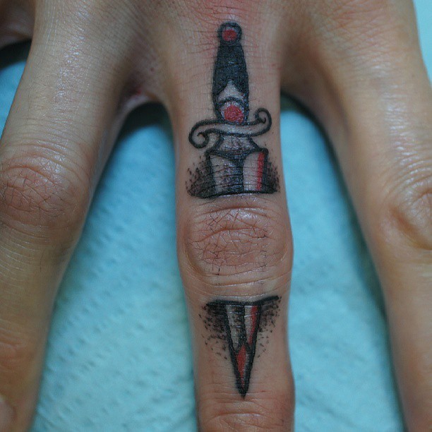 Stabbed finger dagger tattoo
