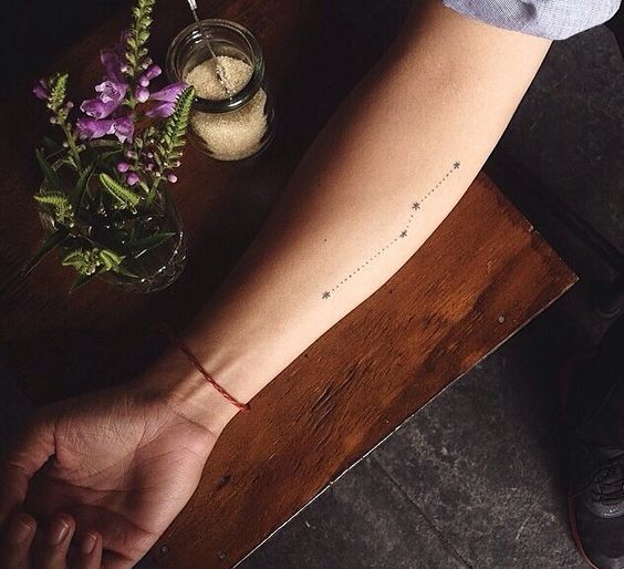 Subtle constellation tattoo on the arm