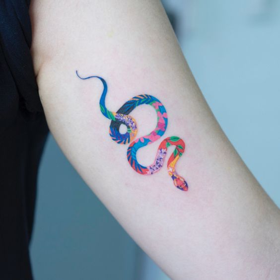 Subtle snake tattoo on the arm