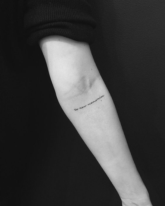 To new memories quote tattoo on the inner arm