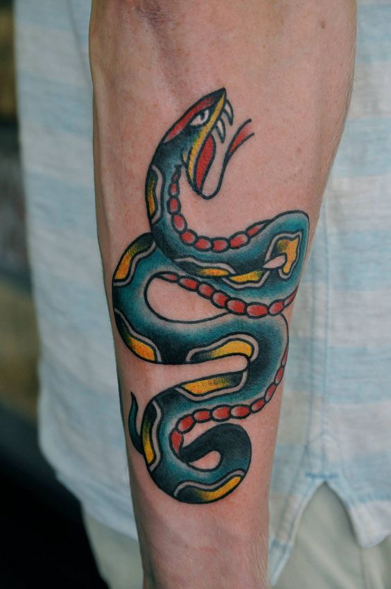 Traditional snake tattoo on the arm