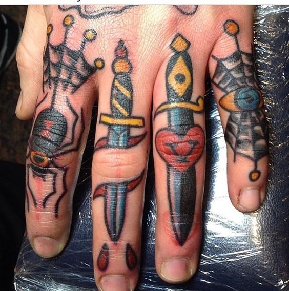 Traditional tattoos on fingers