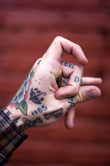 Traditional tattoos on the left hand