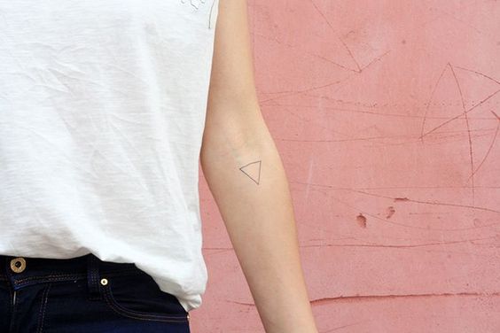 Triangle tattoo on the inner arm