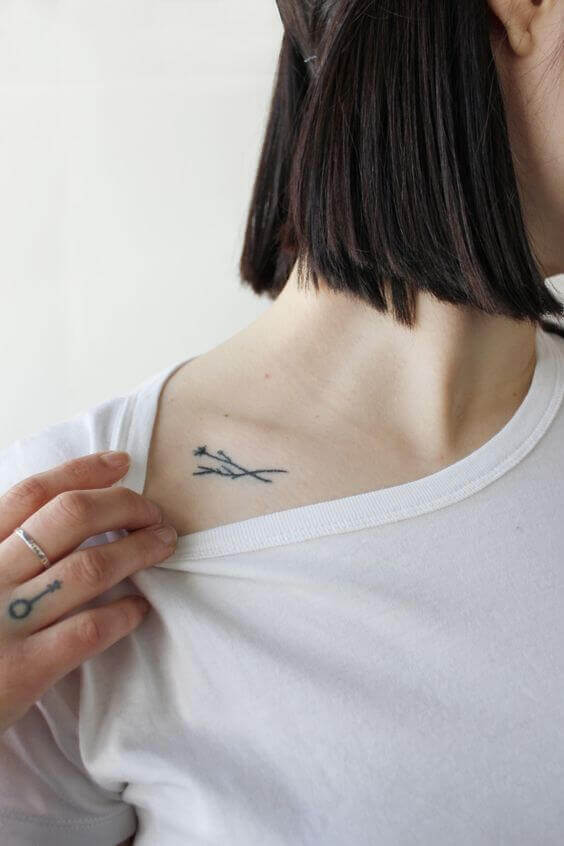 Twigs tattoo on the clavicle