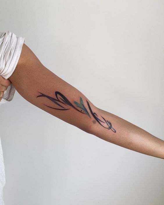Abstract tattoo on the arm by Amanda Wachob