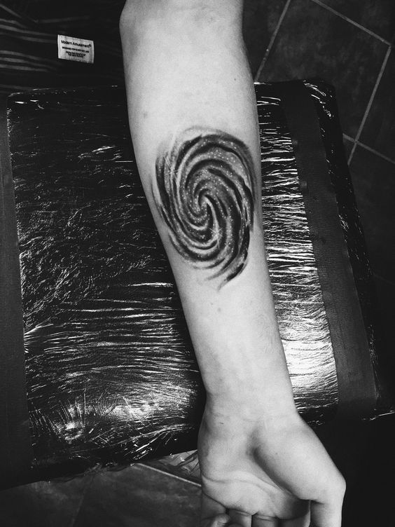 Black and white spiral galaxy tattoo