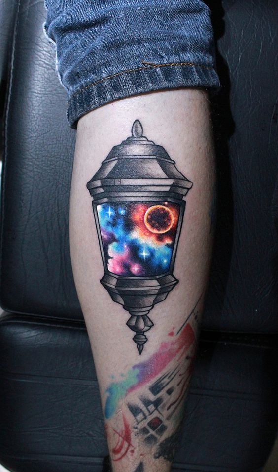 Galaxy lantern tattoo inked on the left calf
