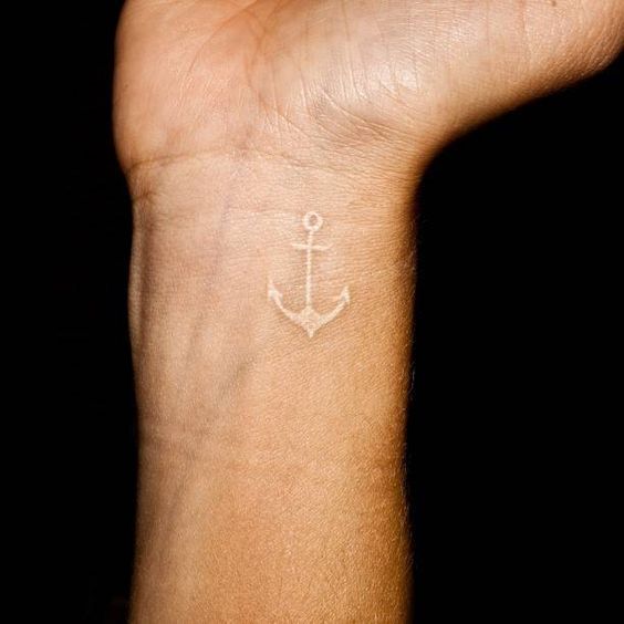 Pretty white anchor tattoo on the wrist