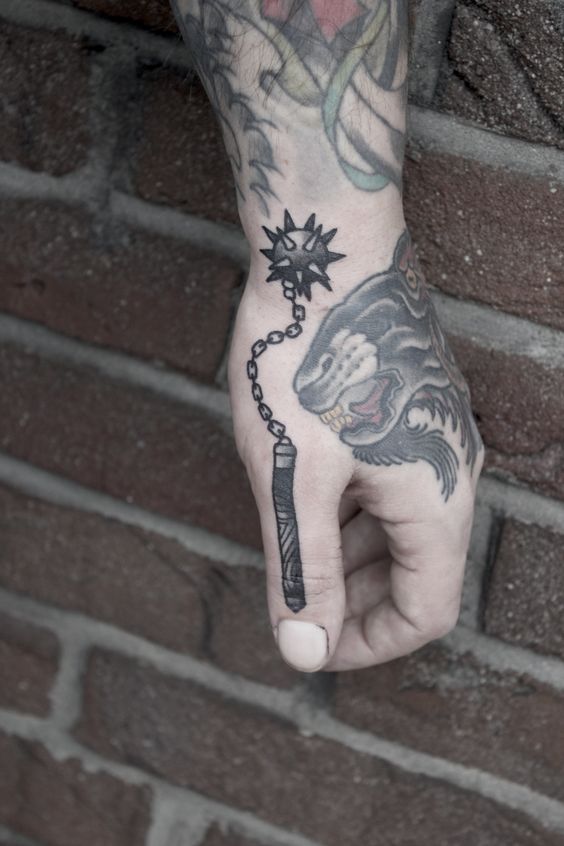 Spiked mace tattoo on the hand