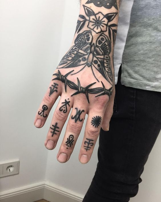 Traditional blackwork tattoo on the hand