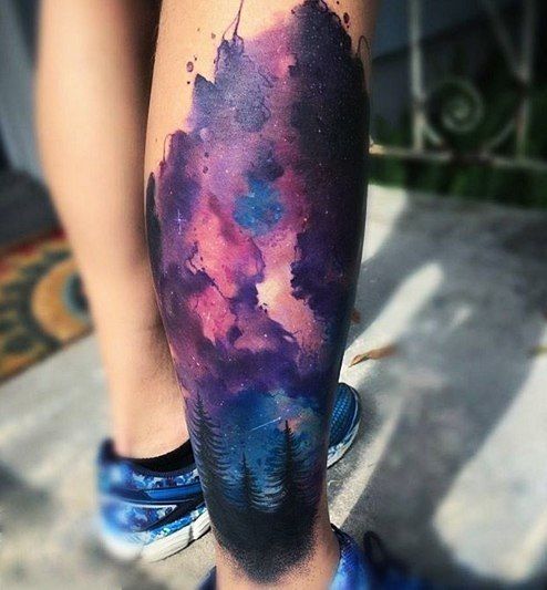 Watercolor cosmic tattoo on the calf