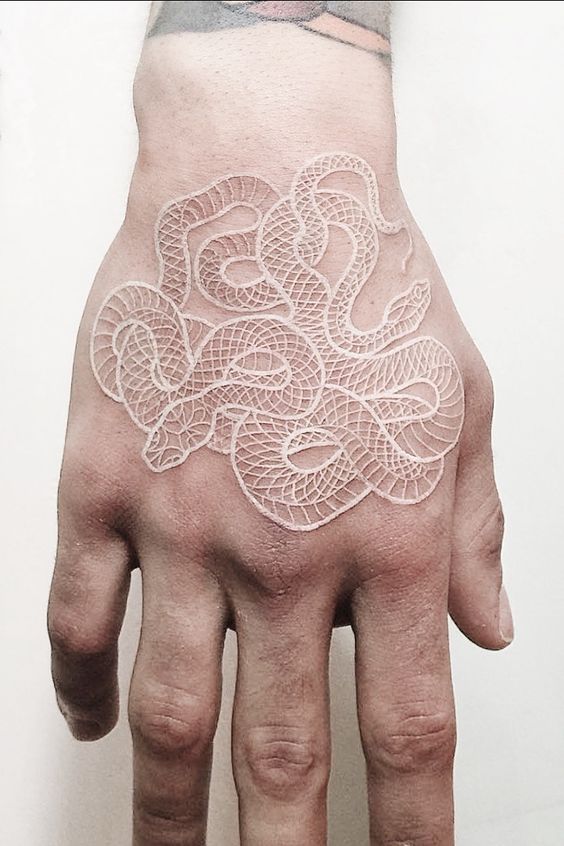 White snake tattoo on the hand