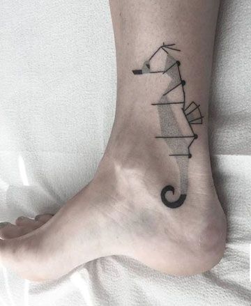Abstract linear seahorse tattoo