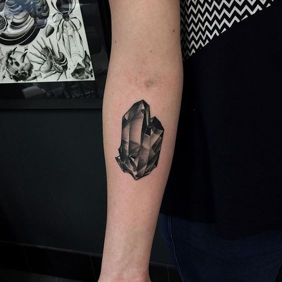 Another black quartz crystal tattoo on the right inner arm