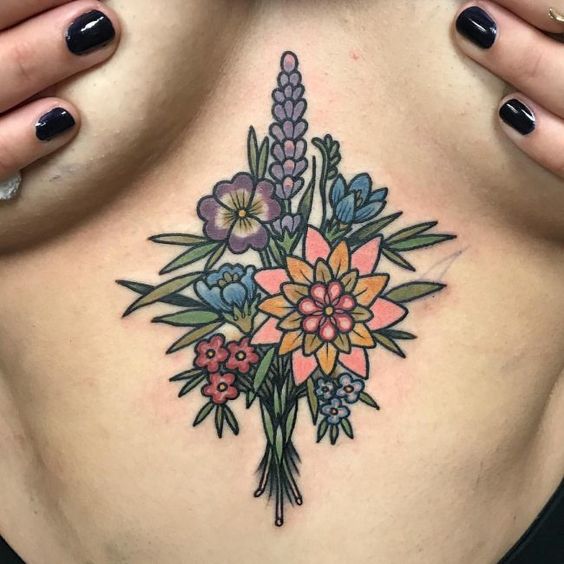 Another colorful flower bouquet tattoo on the sternum