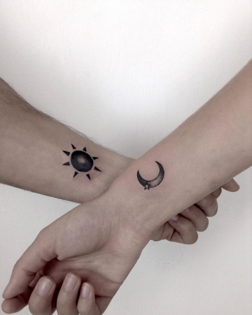 Another matching moon and sun wrist tattoo for a couple