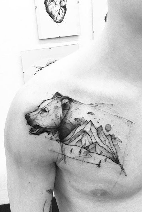 Bear and mountains tattoo on the right side of the chest and shoulder