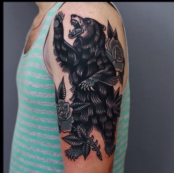 Bear ink in traditional style on the left upper arm