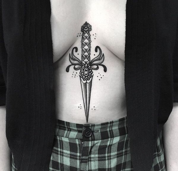 Black dagger tattoo on the breastbone
