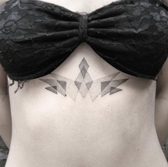 Black dot work style geometric sternum tattoo