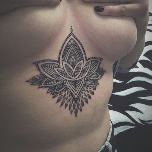 Black lotus flower and mandala sternum tattoo