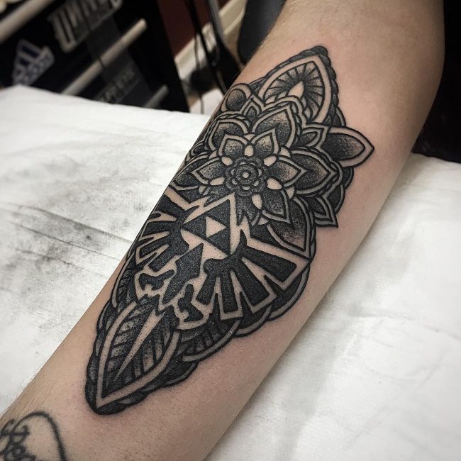 Black mandala and triforce tattoo