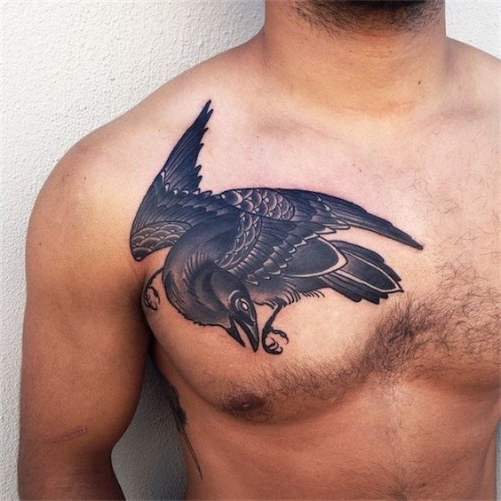 Black raven tattoo on the right side of the chest