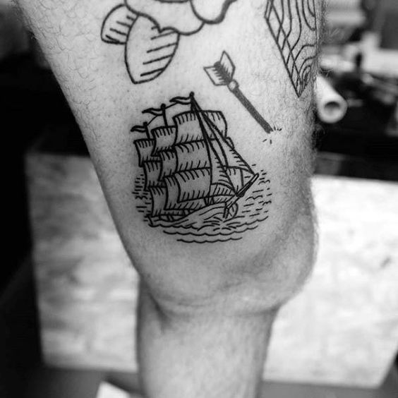 Black sailing three masted ship tattoo on the left inner thigh