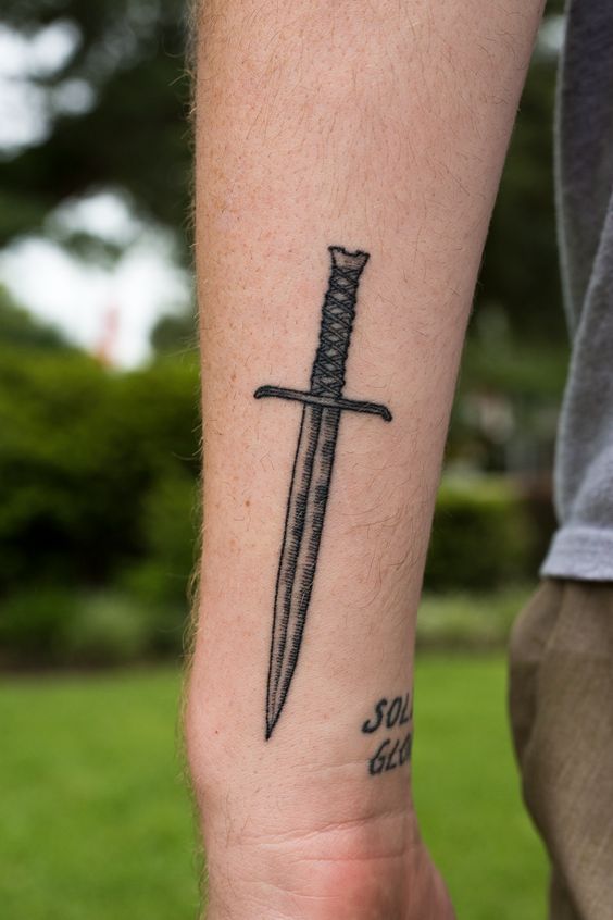 Black sword tattoo on the left wrist