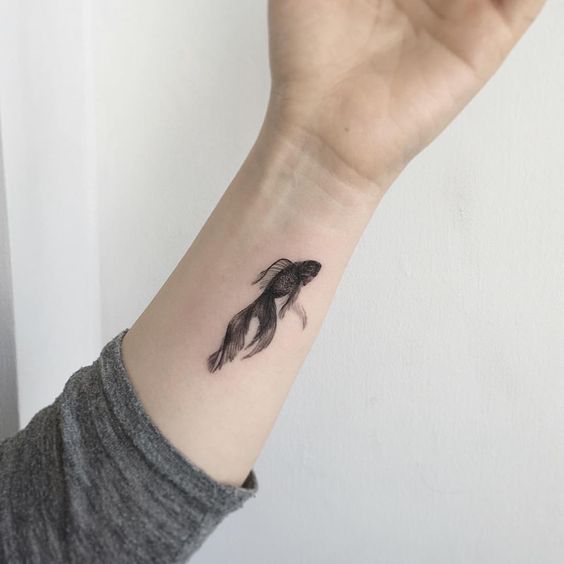Black tattoo of a goldfish